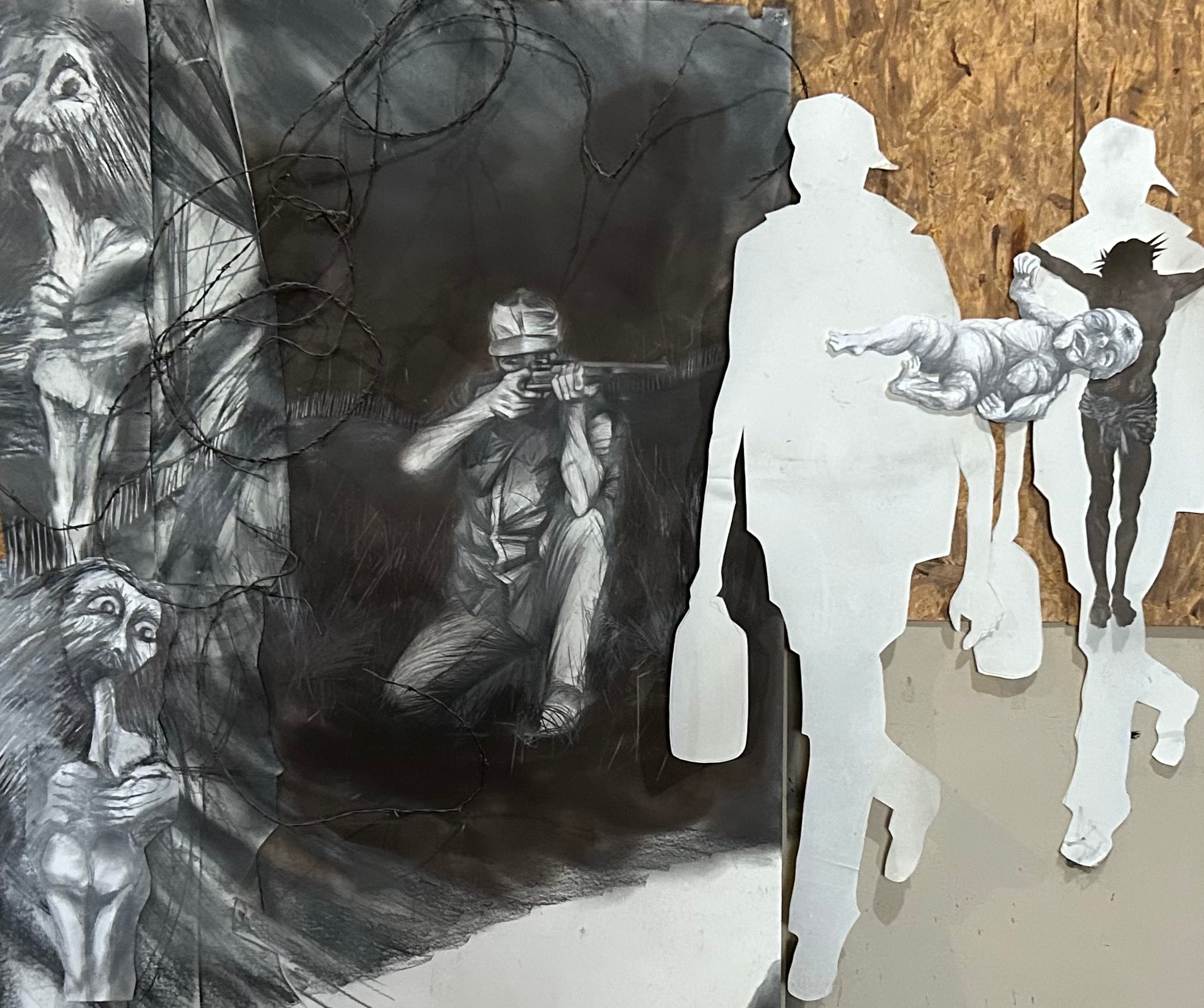 The Sniper — Large-scale mixed media installation by Ricardo Santos Hernández. Inspired by Charles Eisenstein's "The Snipers are the Lucky Ones" (Substack, September 28, 2024) and journalist Chris Hedges' "To the Israeli Soldier Who Murdered Aysenur Ezgi Eygi" (September 17, 2024) — a graphic account of the killing of peace worker Aysenur Eygi by an Israeli sniper. Charcoal drawing, barbed wire, and cut paper silhouettes confront the machinery of violence and the human cost of occupation. by Ricardo Santos Hernández