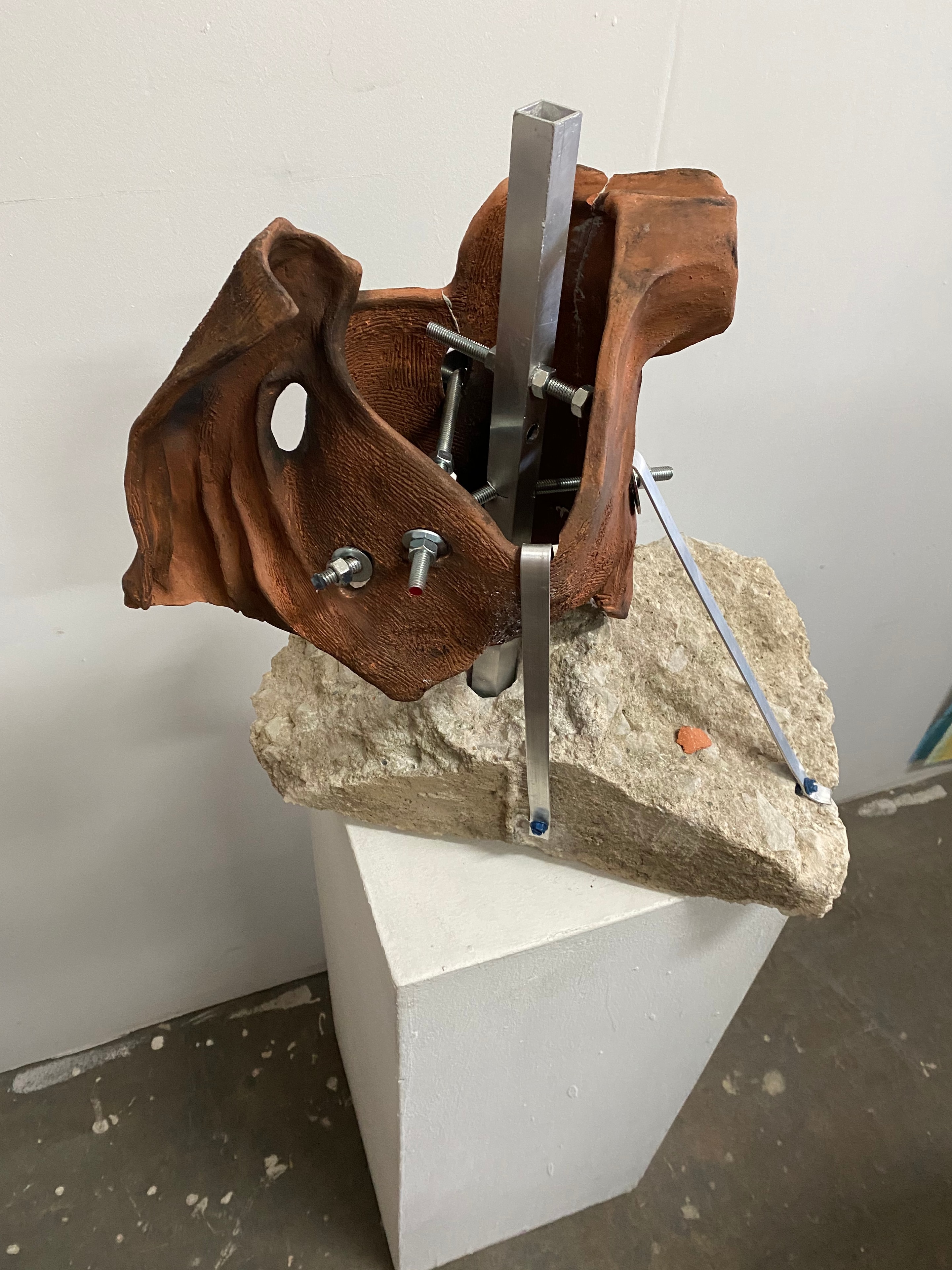 Screwed — Clay torso assembled with screwed rods, found metal, and concrete by Ricardo Santos Hernández