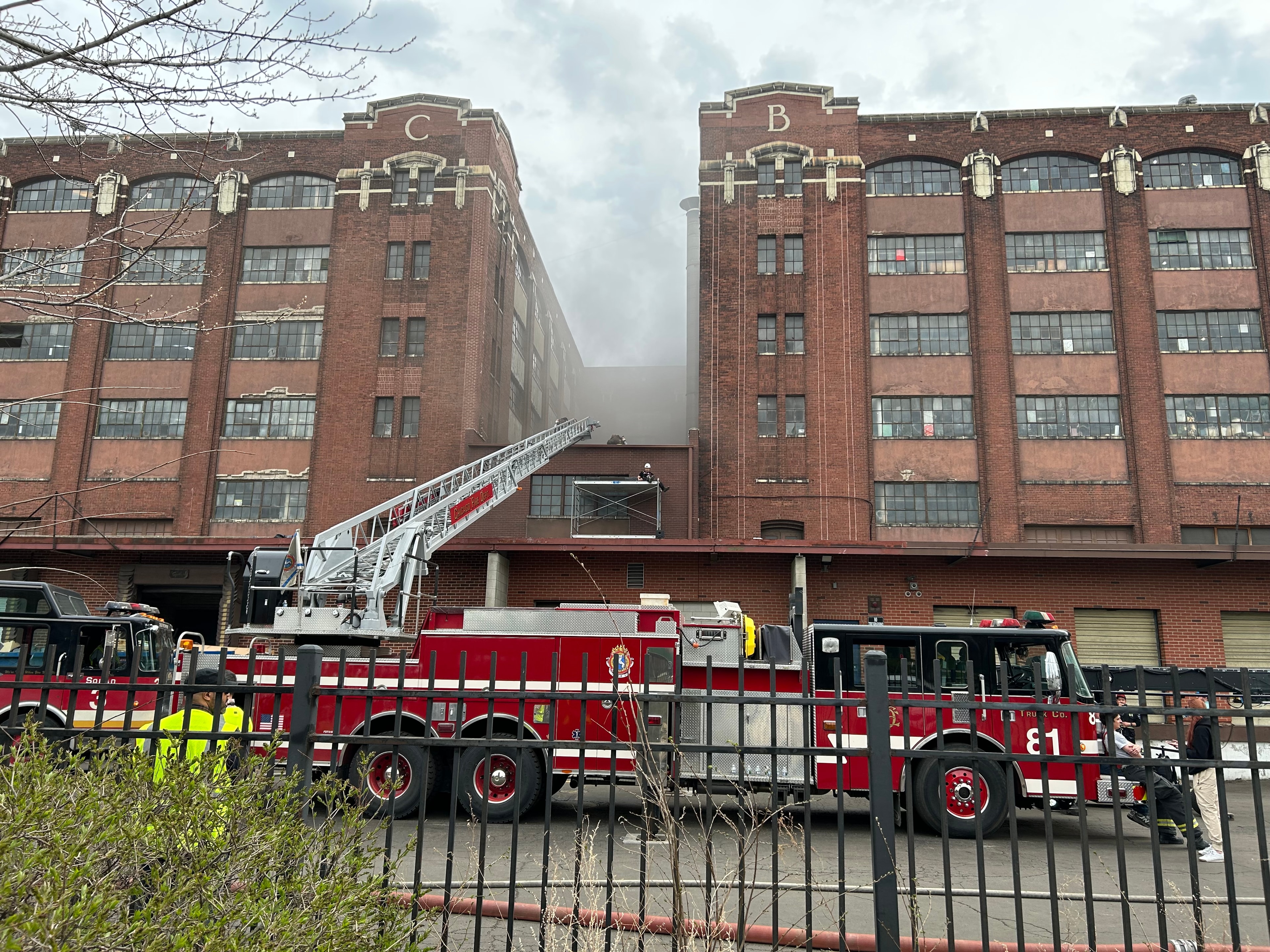 Chicago Fire Filming at Clock Tower Industrial Park — The NBC television series Chicago Fire recently filmed on location at the Clock Tower Industrial Park, Ricardo's studio home. A ladder truck from Engine 81 extends toward the roofline between the iconic C and B brick facades as smoke rises for the cameras. The building that houses Ricardo's sixth-floor studio doubles as a set — its century-old industrial architecture, arched windows, and weathered brick a natural backdrop for the drama of the city. A reminder that the Clock Tower is not just a place of art-making but a living piece of Chicago's history.